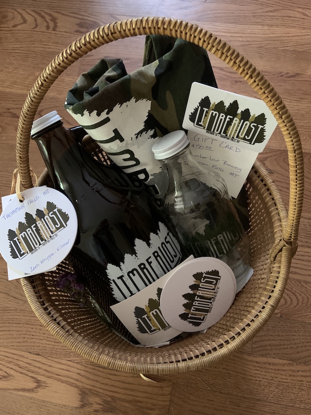 Gift basket with $50 gift card, plus a growler, pint jug, t-shirt and stickers
